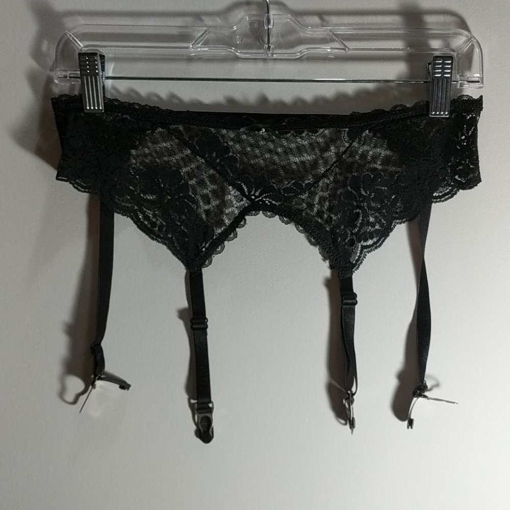 Black garter belt with pearl accent and bow